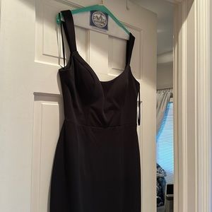 Like new sexy black cocktail dress with left leg slit.